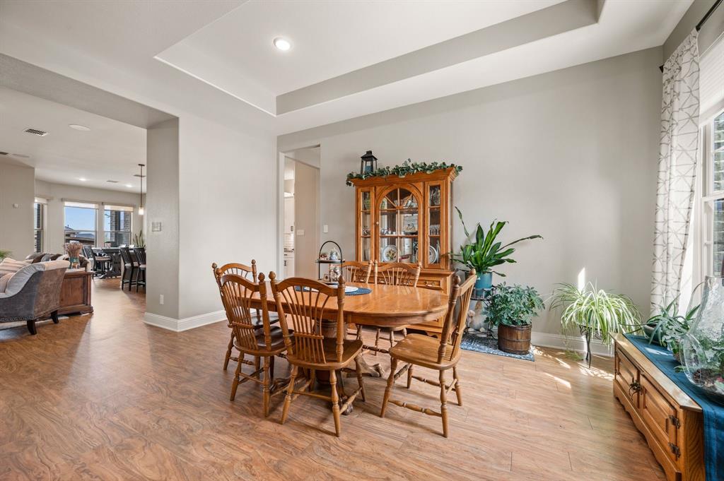1226 Aster Place Haslet, TX 76052 - Photo 5 of 40 a view of a dining room with furniture and wooden floor