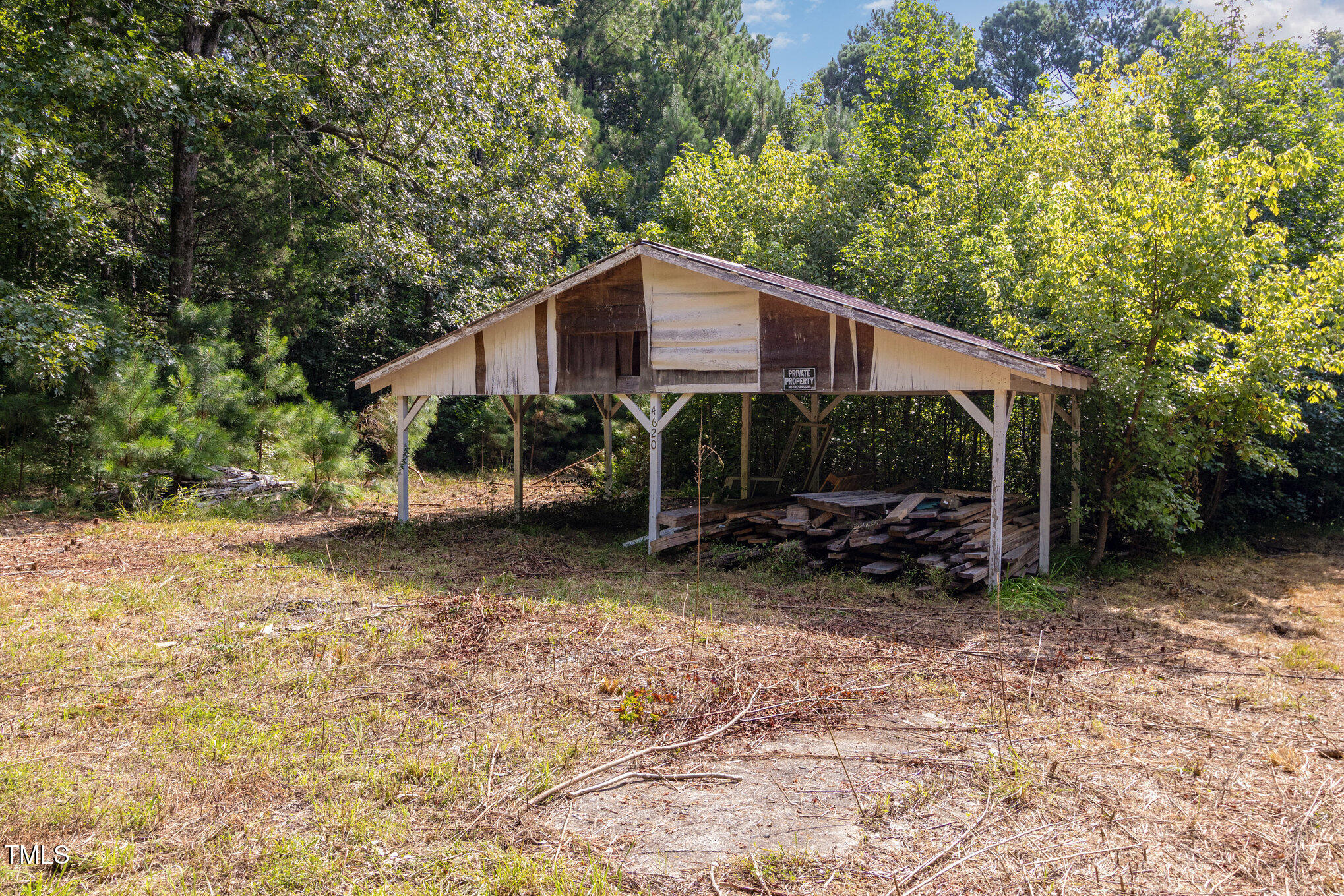 4620 Sams Road Mebane, NC 27302 - Photo 7 of 31 a view of a house with a yard chairs and a large tree