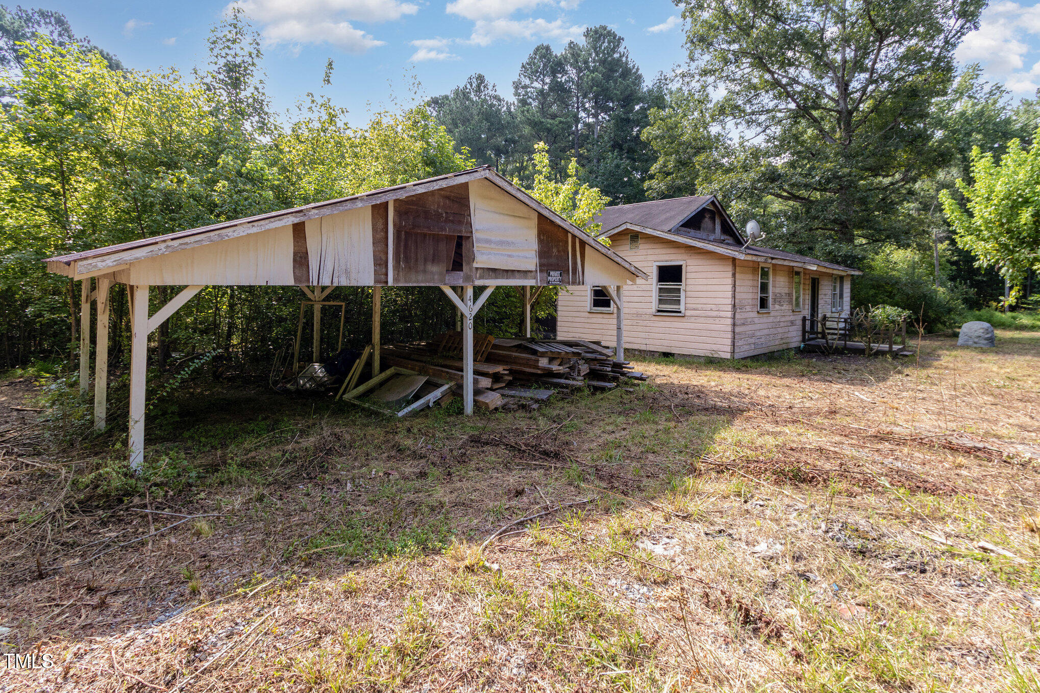 4620 Sams Road Mebane, NC 27302 - Photo 16 of 31 a view of a house with a backyard