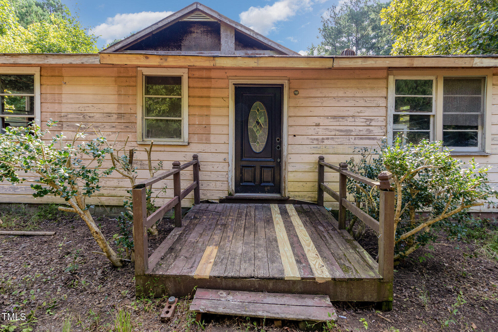 4620 Sams Road Mebane, NC 27302 - Photo 4 of 31 a front view of a house with garden