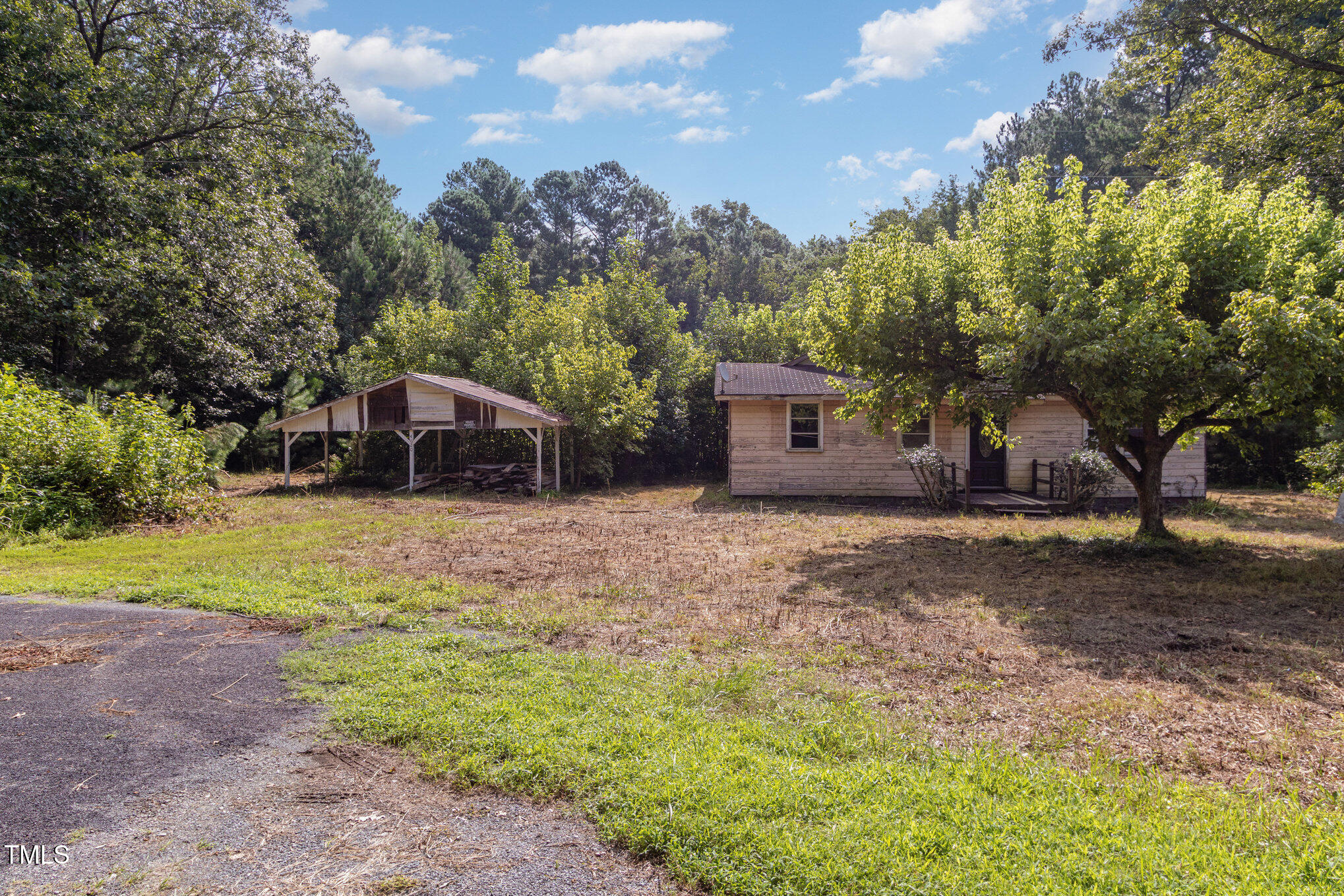 4620 Sams Road Mebane, NC 27302 - Photo 6 of 31 a view of a house with backyard and trees