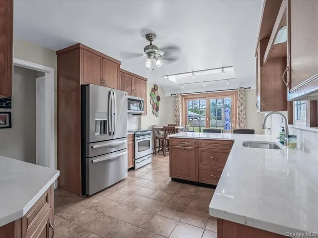 a kitchen with a refrigerator and a sink