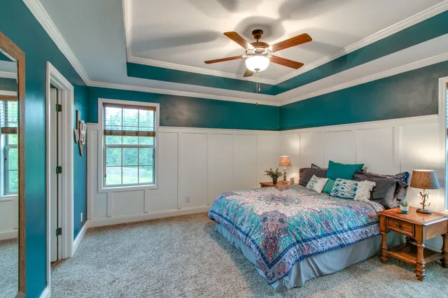 a bed room with furniture and a window