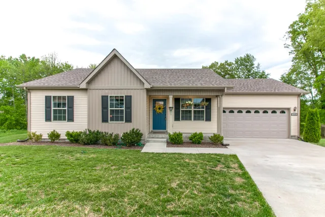a front view of a house with garden