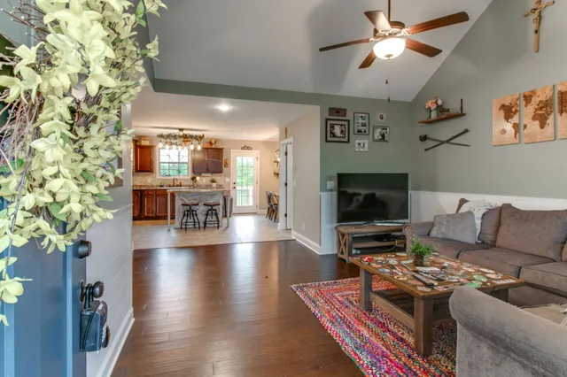 a living room with furniture and a window
