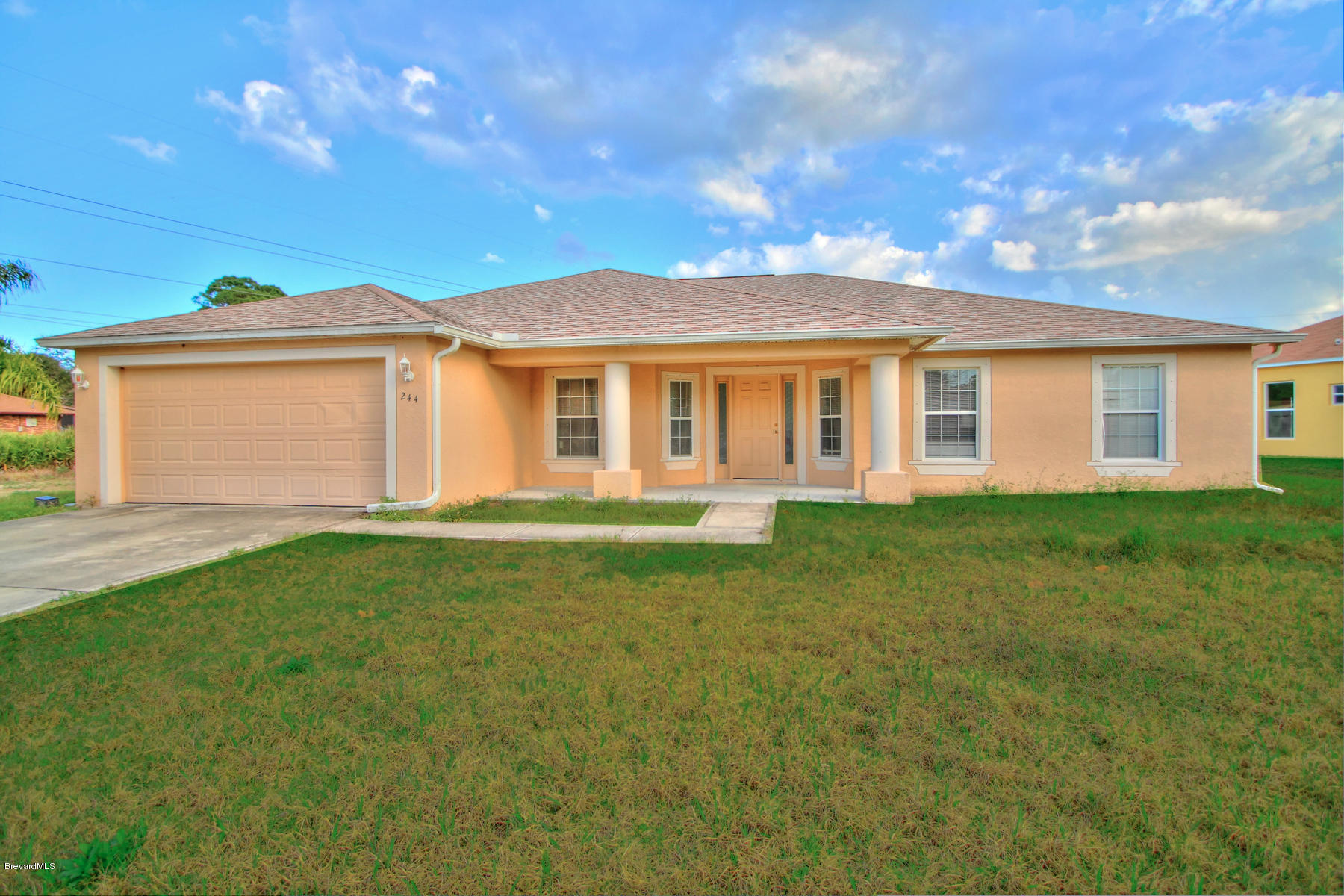 244 Abello Road Southeast Palm Bay, FL 32909 - Photo 1 of 23 a view of a house with a backyard