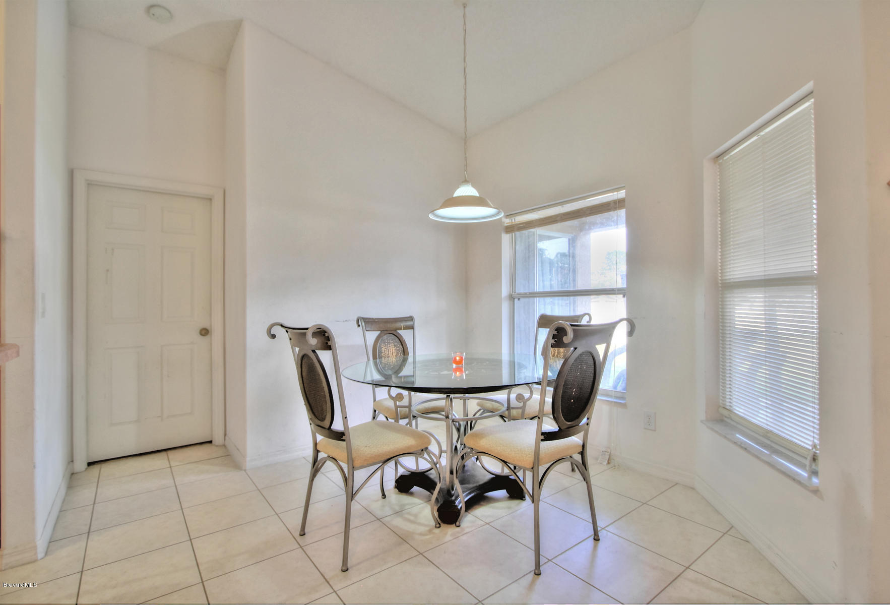 244 Abello Road Southeast Palm Bay, FL 32909 - Photo 13 of 23 a view of a dining room with furniture and a window