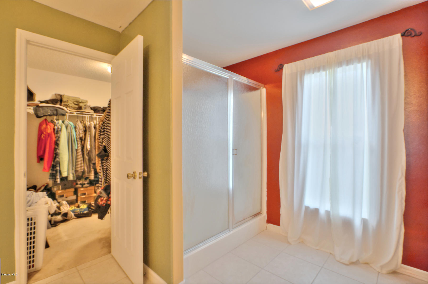 244 Abello Road Southeast Palm Bay, FL 32909 - Photo 17 of 23 a view of a hallway with a door and couch