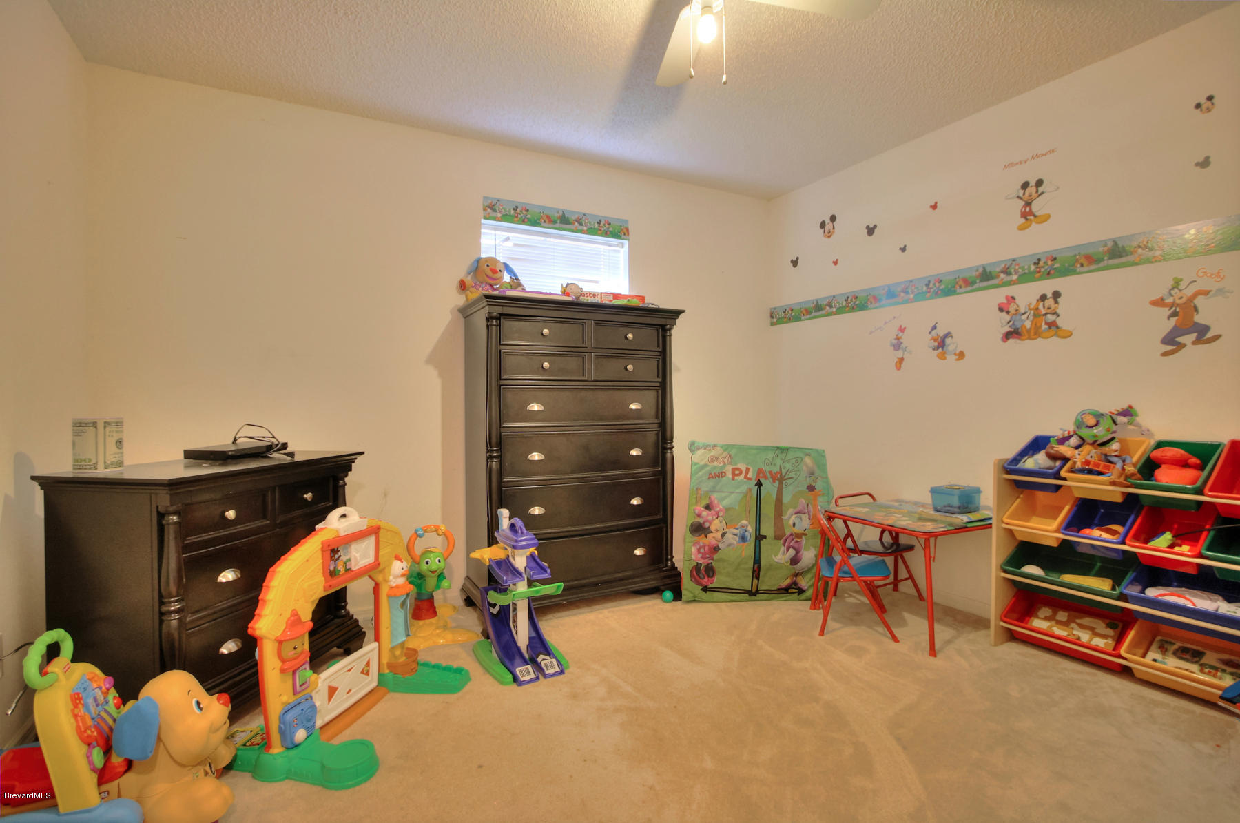 244 Abello Road Southeast Palm Bay, FL 32909 - Photo 18 of 23 a bedroom with a bed and wooden floor