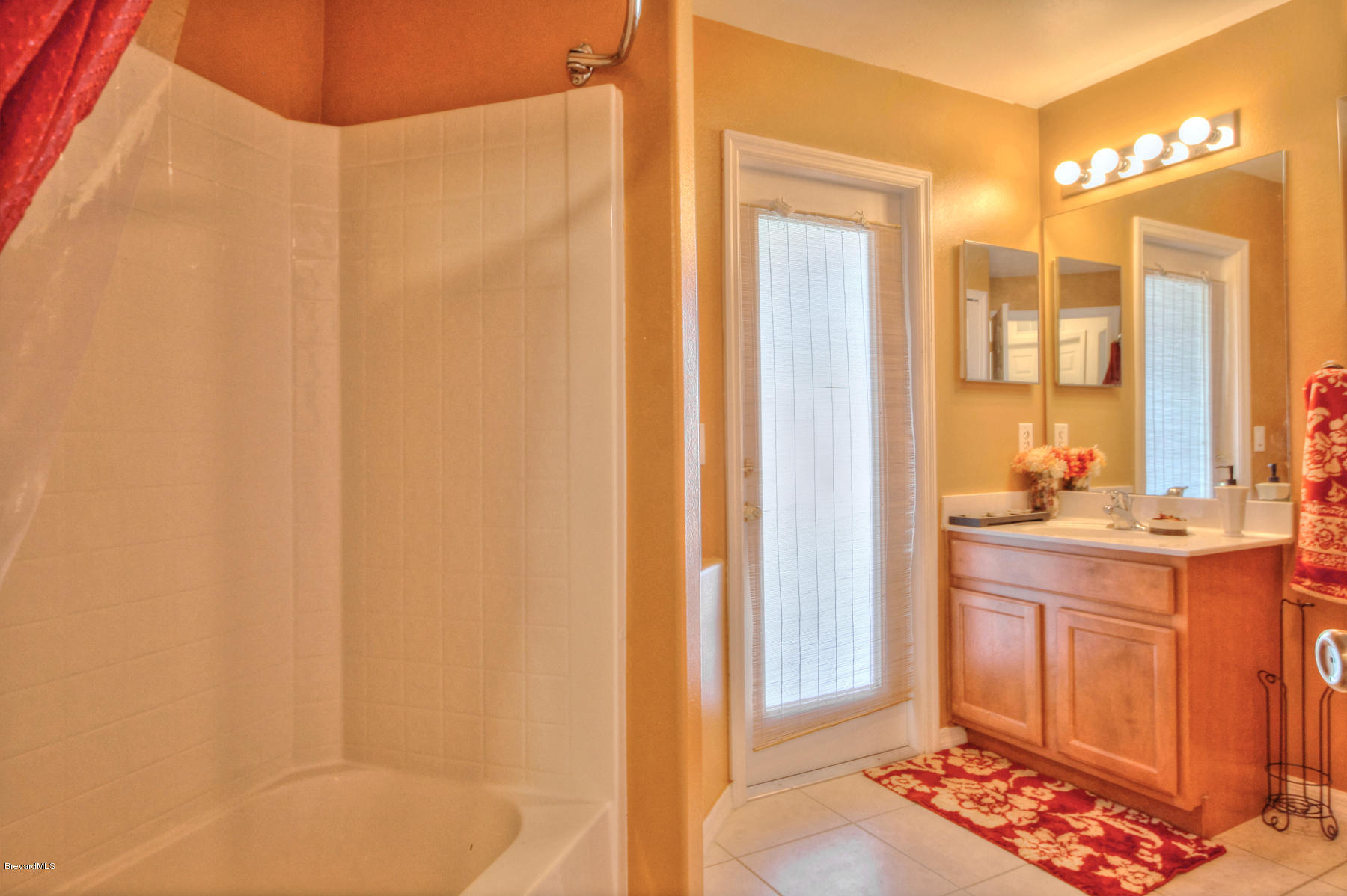 244 Abello Road Southeast Palm Bay, FL 32909 - Photo 21 of 23 a bathroom with a sink and a mirror