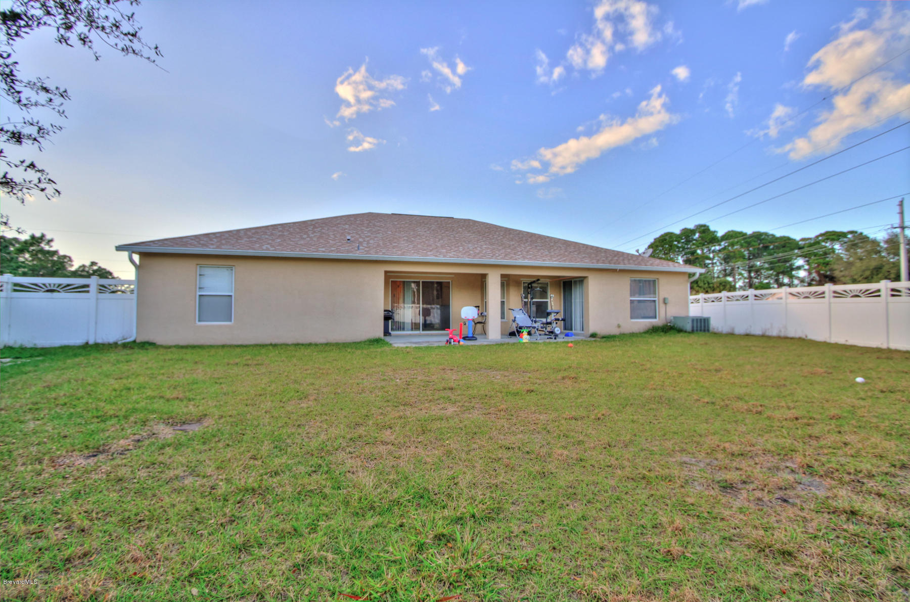 244 Abello Road Southeast Palm Bay, FL 32909 - Photo 22 of 23 a view of a house with a yard