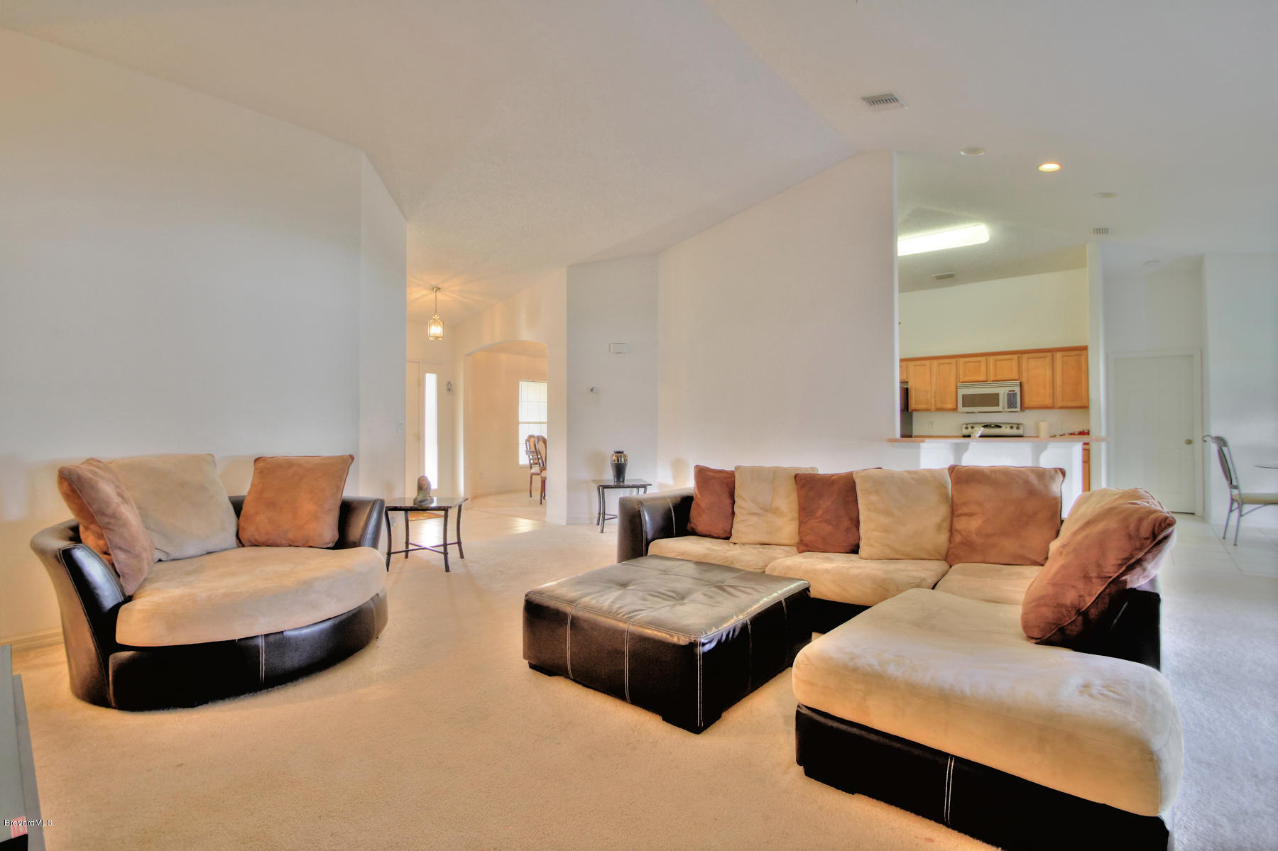 244 Abello Road Southeast Palm Bay, FL 32909 - Photo 5 of 23 a living room with furniture and a couch