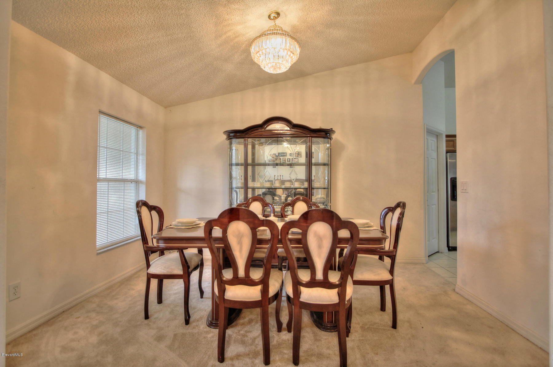 244 Abello Road Southeast Palm Bay, FL 32909 - Photo 7 of 23 a view of a dining room with furniture and wooden floor