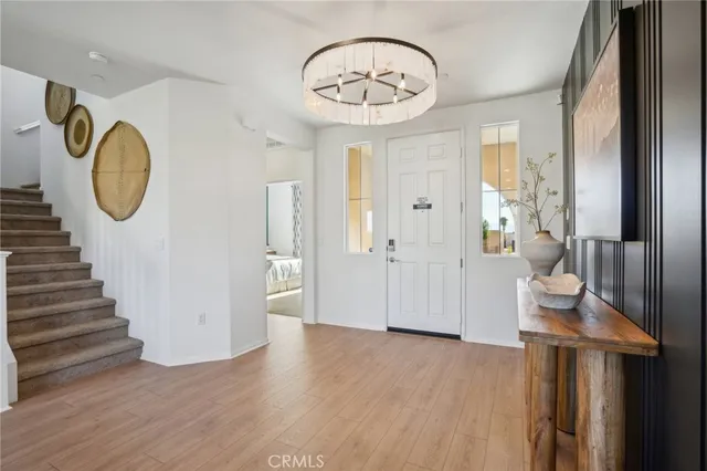 a view of an entryway with wooden floor