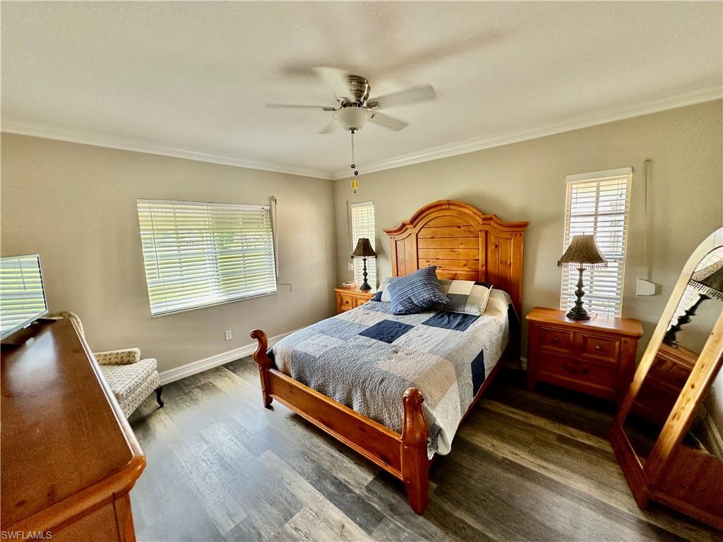 9165 Michael Circle, Unit 1002 Naples, FL 34113 - Photo 19 of 39 a bedroom with bed and window
