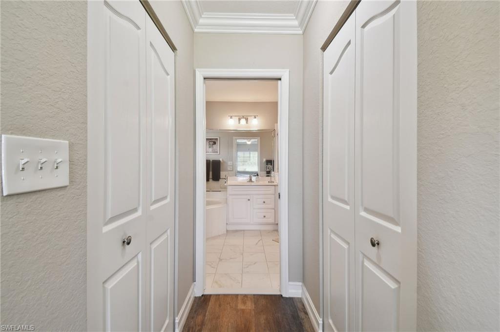9165 Michael Circle, Unit 1002 Naples, FL 34113 - Photo 25 of 39 a bathroom with a shower and a sink