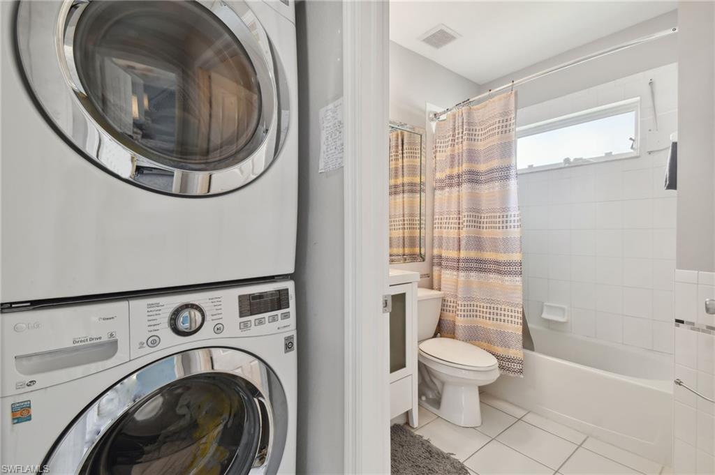 9165 Michael Circle, Unit 1002 Naples, FL 34113 - Photo 28 of 39 a bathroom with a toilet and a sink
