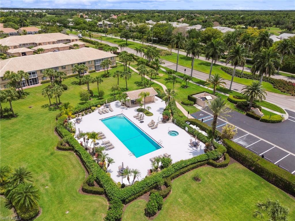 9165 Michael Circle, Unit 1002 Naples, FL 34113 - Photo 33 of 39 an aerial view of residential houses with outdoor space