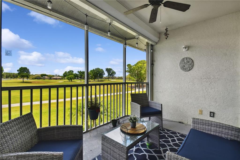 9165 Michael Circle, Unit 1002 Naples, FL 34113 - Photo 37 of 39 a balcony with furniture and a potted plant