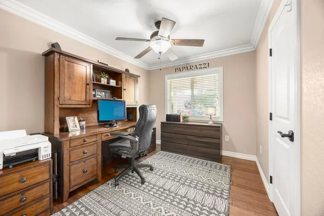 a room with furniture or chandelier and a window