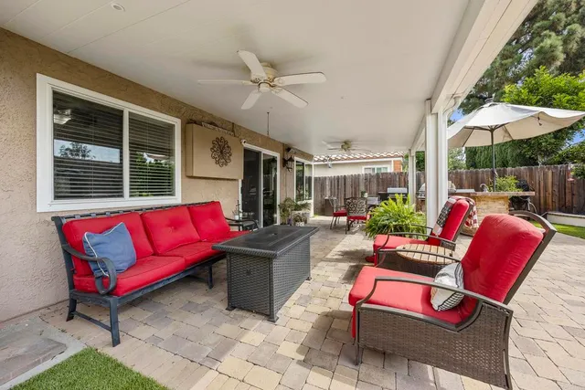 a outdoor living space with furniture and a potted plant