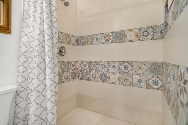 a bathroom with a bathtub and shower