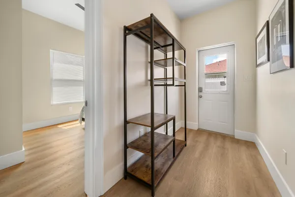 a view of entryway with wooden floor and stairs