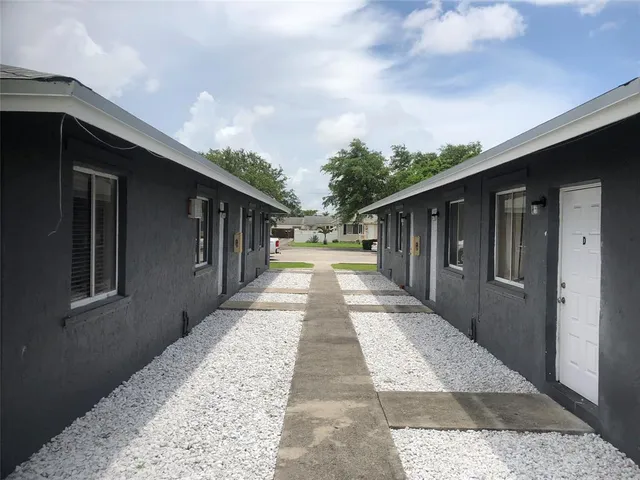 a view of backyard with pathway