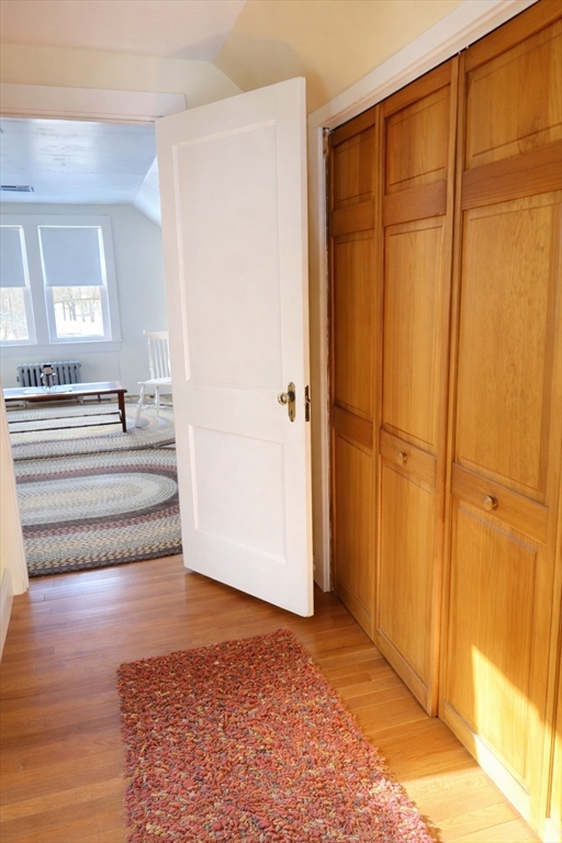 260 Elm Street Walpole, MA 02081 - Photo 20 of 32 a view of a bedroom with wooden floor and cabinet