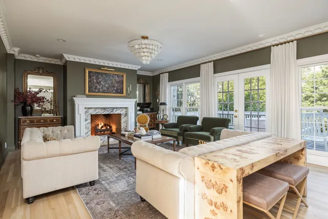 a fireplace with a clock on wall