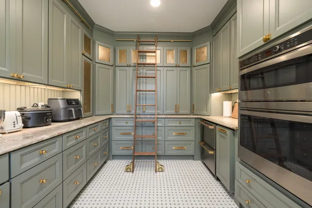 a view of an entryway with a dining table and chairs