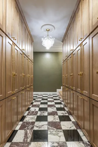 a bed room with large bed and windows