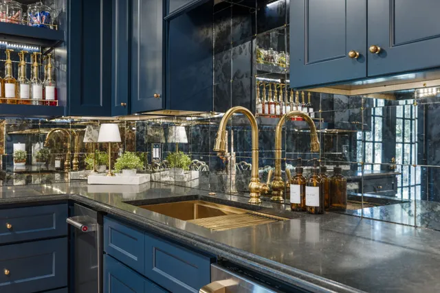 a front view of a house with a yard and trees