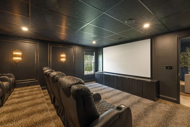 an aerial view of residential houses with outdoor space and trees