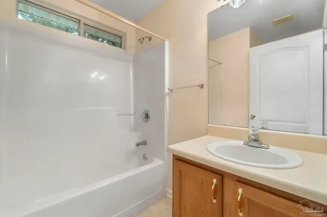 a bathroom with a sink and a bathtub
