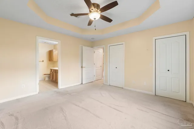 a view of empty room with ceiling fan