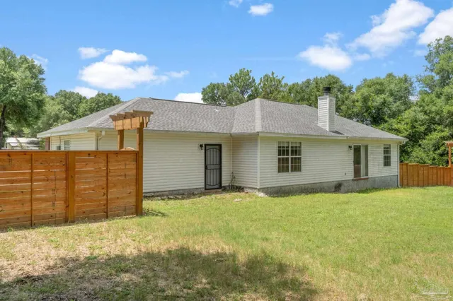 a front view of a house with yard