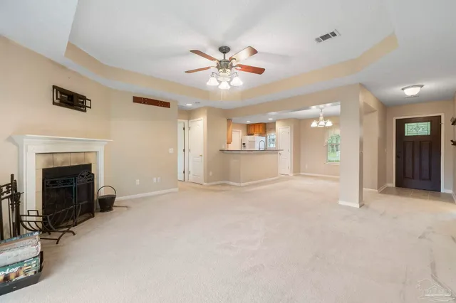 a view of an empty room with a fireplace