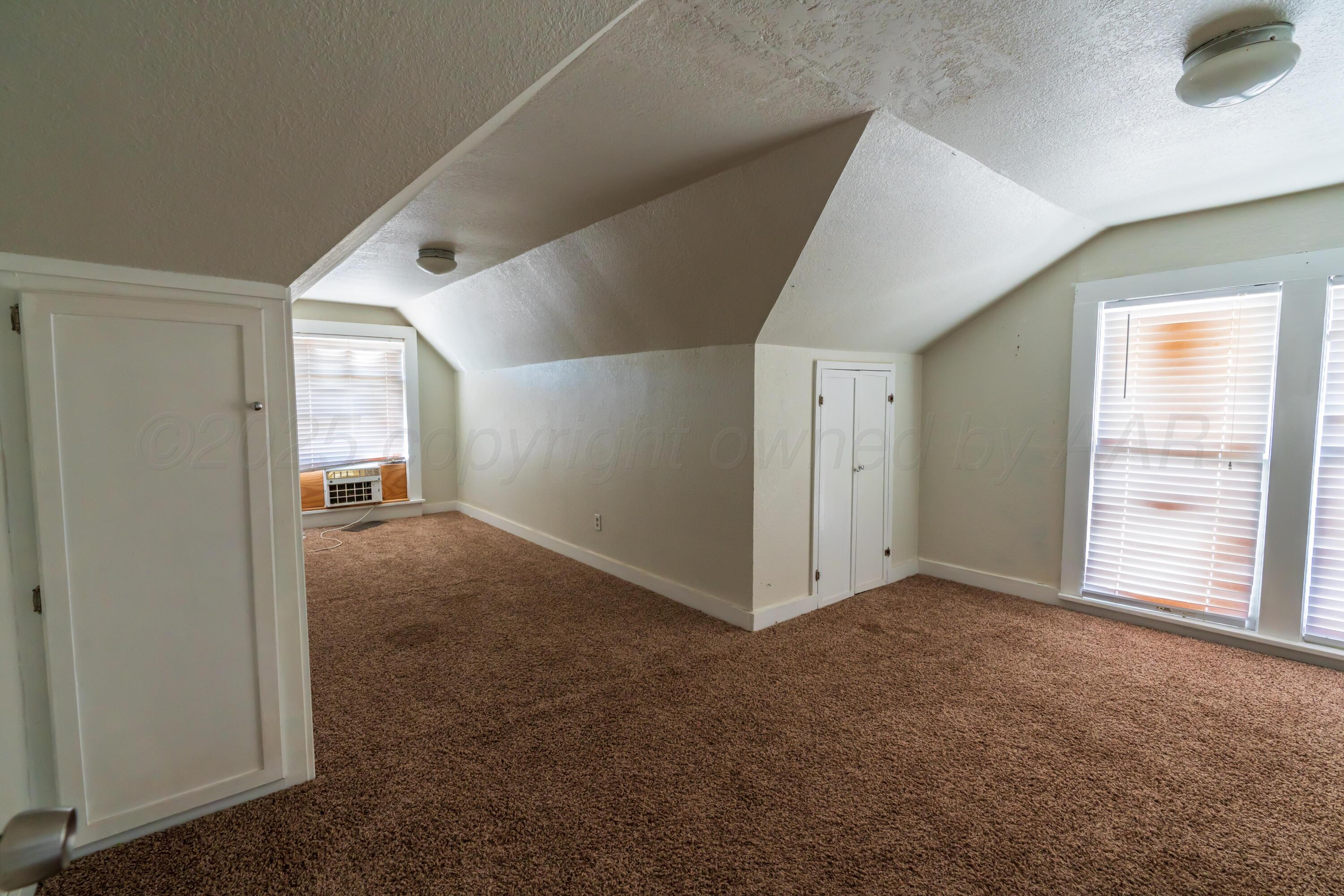 1220 Southwest 12th Avenue Amarillo, TX 79102 - Photo 18 of 25 a view of an empty room with a window