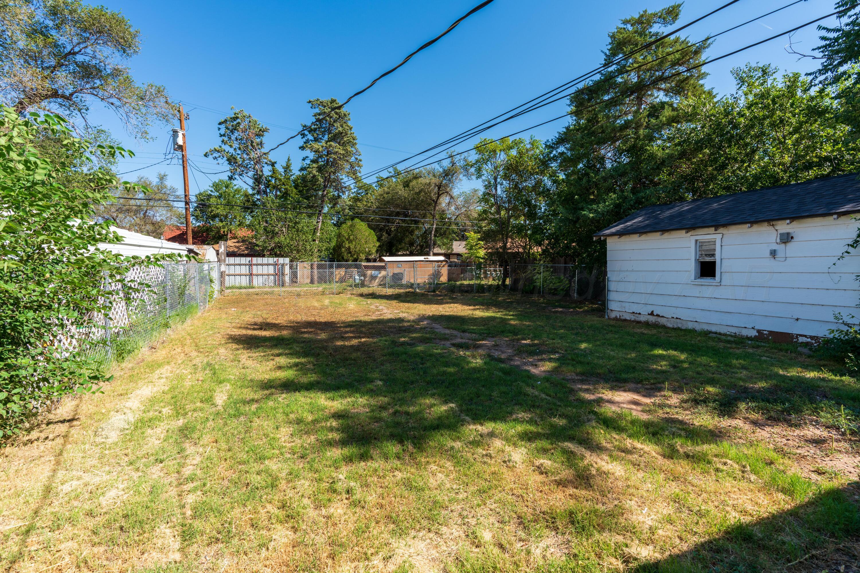 1220 Southwest 12th Avenue Amarillo, TX 79102 - Photo 21 of 25 a view of a backyard with plants and trees