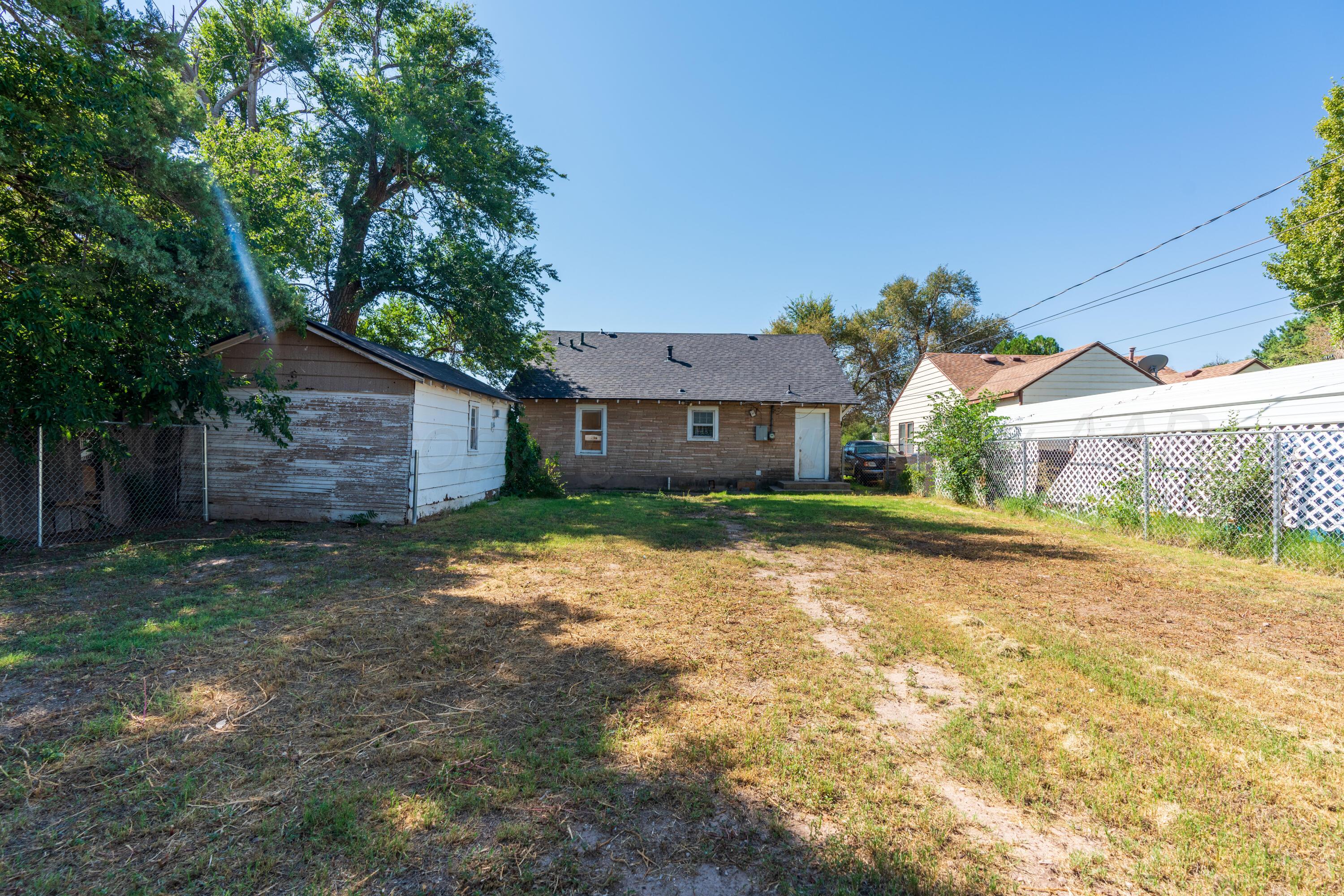 1220 Southwest 12th Avenue Amarillo, TX 79102 - Photo 22 of 25 a view of a house with a yard