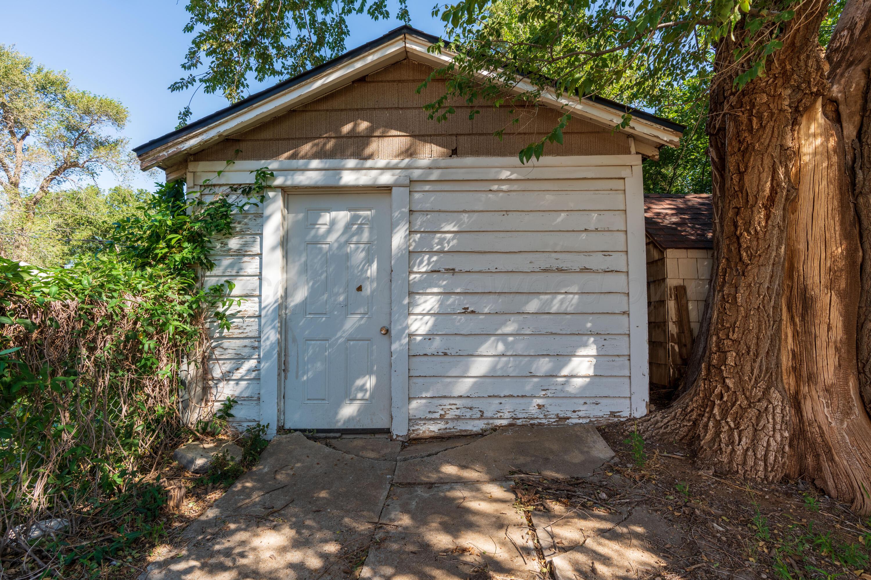 1220 Southwest 12th Avenue Amarillo, TX 79102 - Photo 23 of 25 a front view of a house with a yard