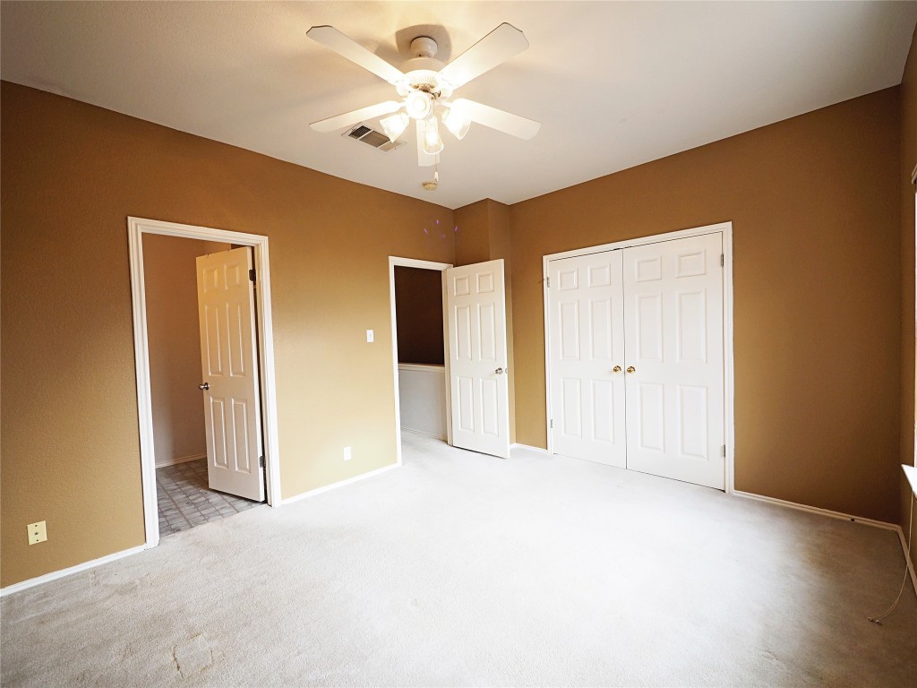 12401 Los Indios Trail, Unit 13 Austin, TX 78729 - Photo 11 of 27 a view of a livingroom with a chandelier fan