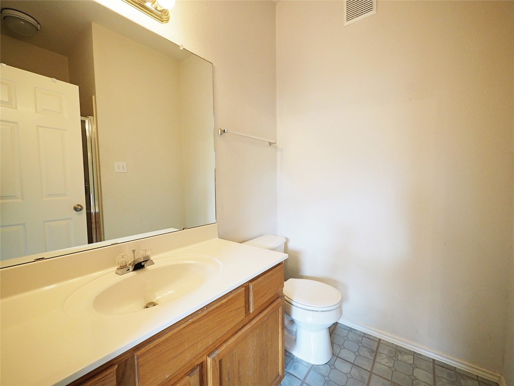 12401 Los Indios Trail, Unit 13 Austin, TX 78729 - Photo 14 of 27 a bathroom with a sink and a mirror