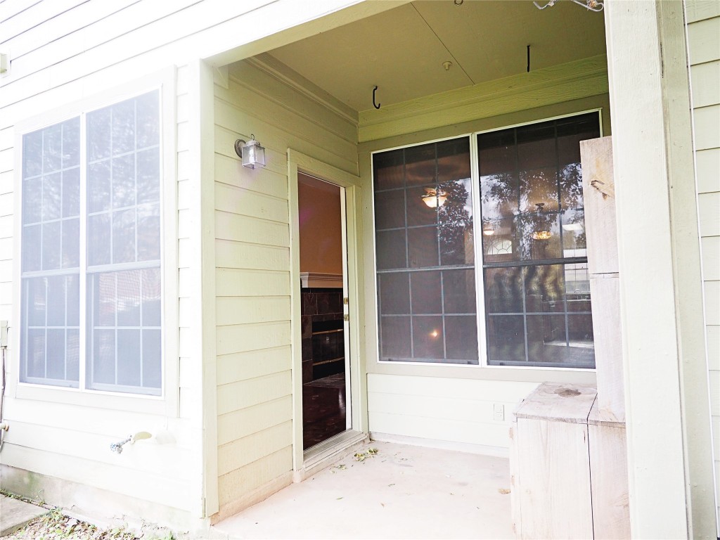 12401 Los Indios Trail, Unit 13 Austin, TX 78729 - Photo 15 of 27 a view of entrance door of the house