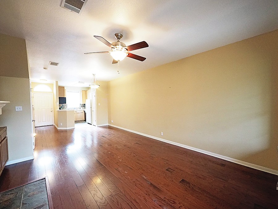 12401 Los Indios Trail, Unit 13 Austin, TX 78729 - Photo 20 of 27 a view of a livingroom with wooden floor