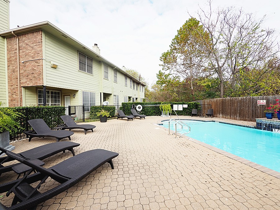 12401 Los Indios Trail, Unit 13 Austin, TX 78729 - Photo 24 of 27 a view of a patio with swimming pool table and chairs