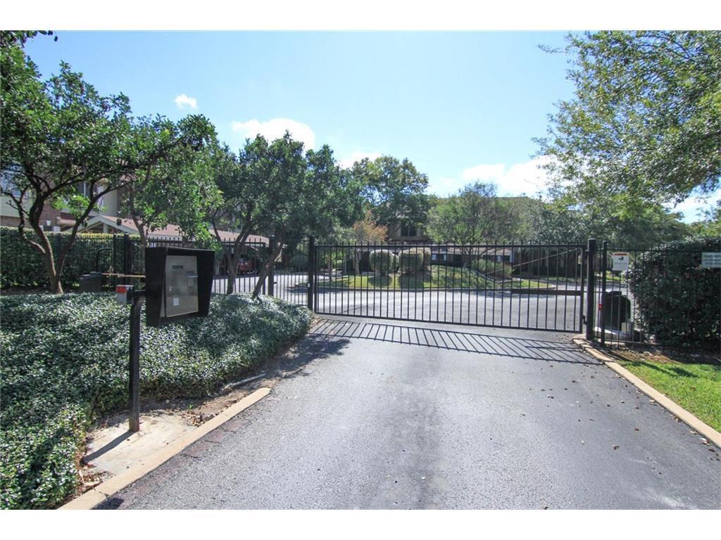 12401 Los Indios Trail, Unit 13 Austin, TX 78729 - Photo 25 of 27 a view of a garden with a bench in it