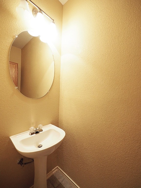 12401 Los Indios Trail, Unit 13 Austin, TX 78729 - Photo 4 of 27 a bathroom with a sink and a mirror