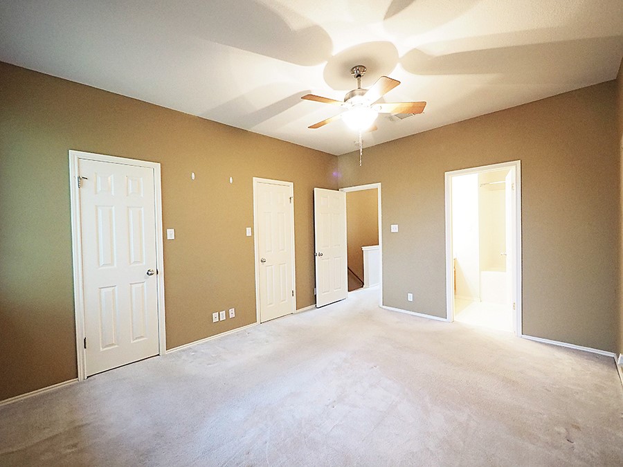 12401 Los Indios Trail, Unit 13 Austin, TX 78729 - Photo 6 of 27 a view of an empty room with a window